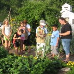 Carole shows off the Children's Garden vegetables