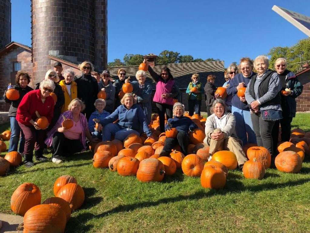 Club members enjoying a fall day amongst the pumpkins at Van Hoosen Farm